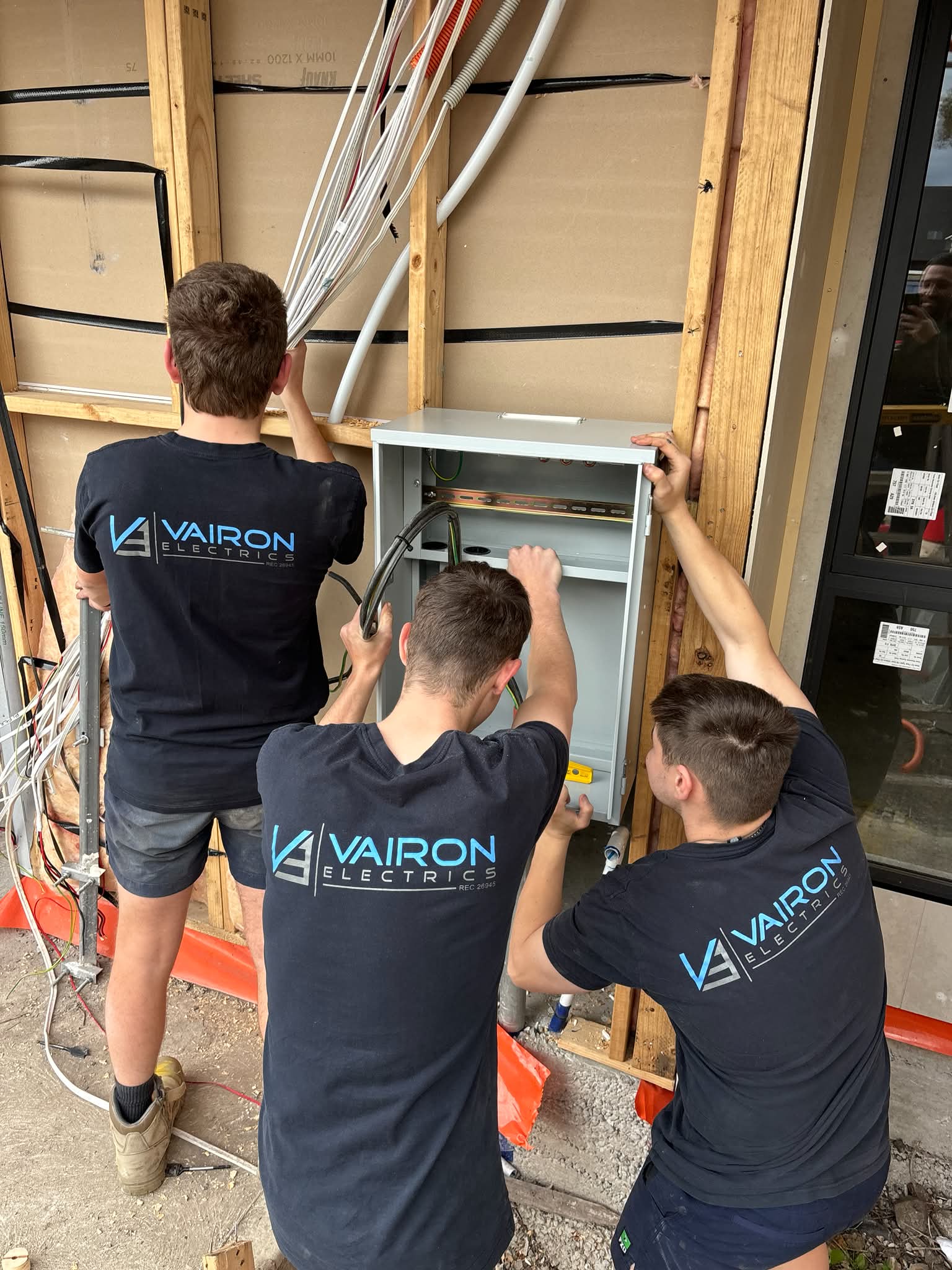 Vairon Electrics team installing a switchboard